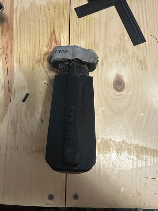 visor/headrest mounted tourniquet holder